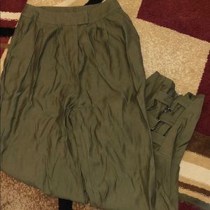Green trousers with ankle grunge design